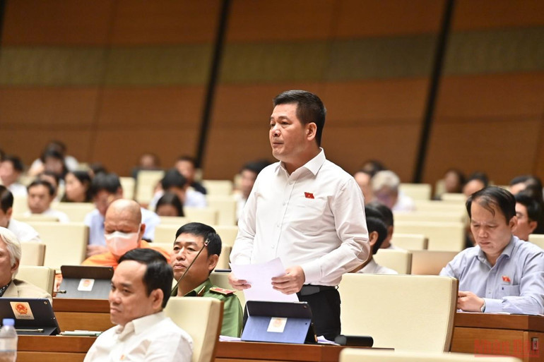 Bộ trưởng Công thương Nguyễn Hồng Diên phát biểu tại phiên chất vấn của Quốc hội chiều 7/6. (Ảnh: LINH KHOA) Bộ trưởng Công thương: Thị trường đang rộng mở cho nông sản Việt -0