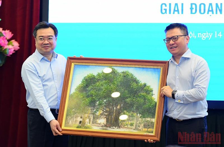 Tăng cường hợp tác thông tin tuyên truyền giữa Báo Nhân Dân và Bộ Xây dựng -0