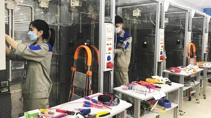 Lao động học tập tại trường nghề trước khi đi xuất khẩu lao động. Ảnh: MINH TÂM Nâng tầm cho lao động xuất khẩu -0