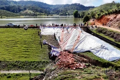 Khu vực xảy ra sạt trượt vai đập chính hồ thủy lợi Cay An đã được các lực lượng chức năng xử lý tạm thời.