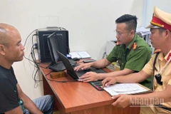 Trần Minh Hoàng tại cơ quan công an.