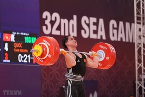 Nguyễn Quốc Toàn phá kỷ lục SEA Games tại môn Cử tạ hạng 89kg Nam. (Ảnh: TTXVN)