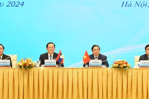 Thủ tướng Phạm Minh Chính và Thủ tướng Lào Sonexay Siphandone chủ trì Hội nghị Hợp tác đầu tư Việt Nam-Lào.