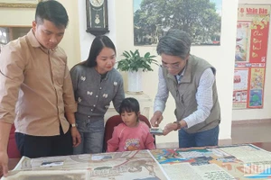 Bạn đọc trên vùng đất Nam Tây Nguyên hào hứng với phụ san đặc biệt của Báo Nhân Dân .