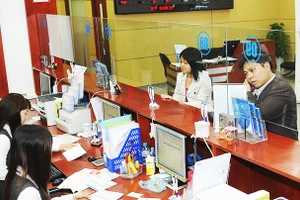 Nhu cầu vay vốn của các doanh nghiệp chưa cao. Ảnh: NAM ANH