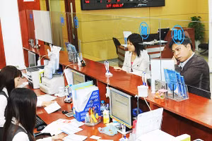 Nhu cầu vay vốn của các doanh nghiệp chưa cao. Ảnh: NAM ANH