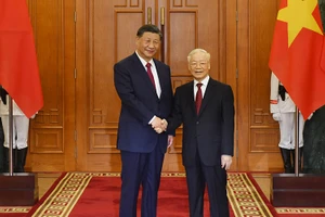 Tổng Bí thư Nguyễn Phú Trọng với Tổng Bí thư, Chủ tịch Trung Quốc Tập Cận Bình. (Ảnh: ĐĂNG KHOA)