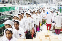 Công nhân làm việc tại một nhà máy dệt may của Ấn Độ. Ảnh: THE ECONOMIST