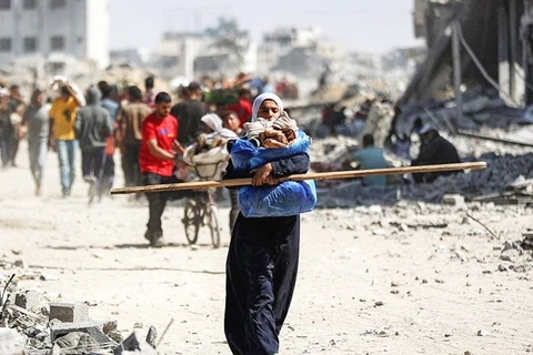 Thời Nay - Trang 1 Người Dân Palestine Trở Về Thành Phố Gaza. Ảnh: Afp