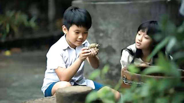 Cảnh trong phim “Tôi thấy hoa vàng trên cỏ xanh” của đạo diễn Victor Vũ.