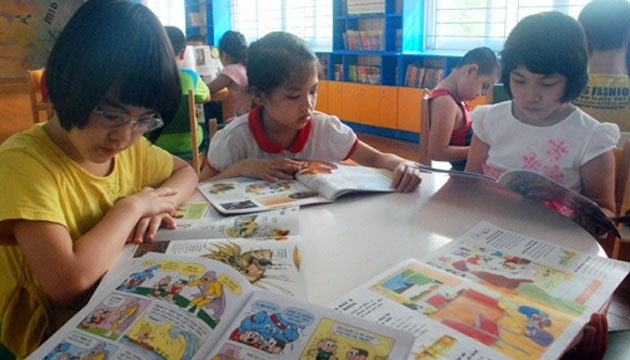 Giờ đọc sách tại thư viện của các em học sinh Trường tiểu học Nghĩa Tân (Hà Nội). Ảnh: DUY LINH