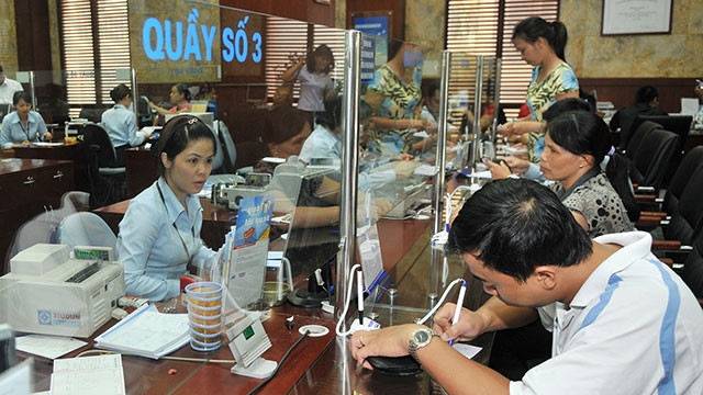 Mặc dù lãi suất huy động bắt đầu tăng nhưng lãi suất cho vay với sản xuất, kinh doanh vẫn tương đối ổn định. Ảnh: NAM ANH