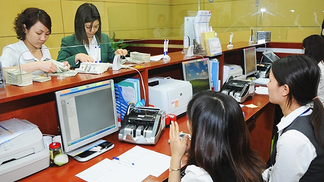 Nhờ nguồn cung ngoại tệ dồi dào, tỷ giá không có nhiều biến động. Ảnh: SONG ANH