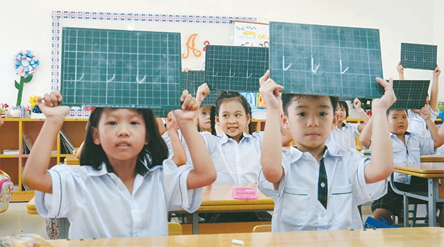 Giờ học của học sinh Trường tiểu học khu đô thị Sài Ðồng (Gia Lâm). Ảnh: MINH HÀ