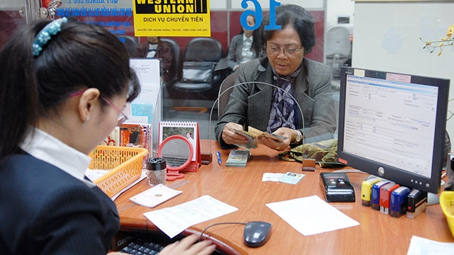 Thời gian qua, nhiều kiều bào gửi tiền về quê hương để đầu tư, kinh doanh. Ảnh: HẢI ANH