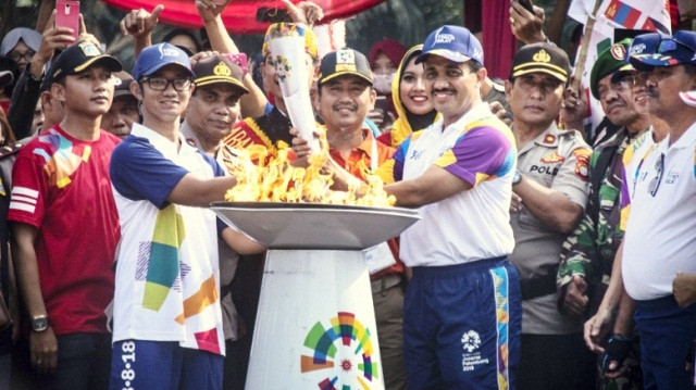 Ngọn đuốc của kỳ Đại hội thể thao châu Á 2018 đã đến Jakarta vào ngày 15-8 sau hành trình 18 nghìn km trên khắp Indonesia. (Ảnh: Jakarta Post)
