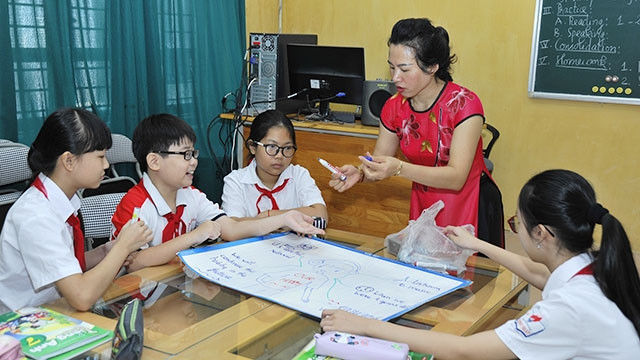 Năng lực đội ngũ giáo viên quyết định nhiều đến chất lượng đào tạo môn tiếng Anh. Ảnh: NG.HẢI