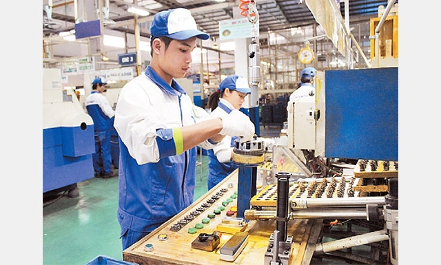 Dây chuyền sản xuất linh kiện xe máy tại Công ty TNHH EXEDY Việt Nam (Khu công nghiệp Khai Quang, Vĩnh Phúc). Ảnh: ÐẶNG TIẾN