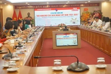 Toàn cảnh lễ ra mắt cuốn sách ảnh về 100 năm Báo chí Cách mạng Việt Nam. 