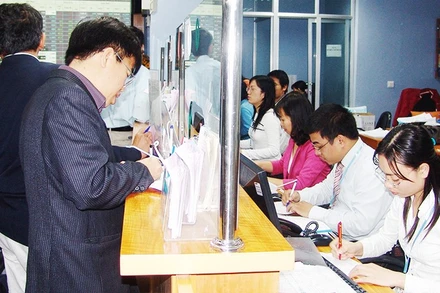 Nhiều công ty chứng khoán đã phải tính đến phương án tăng vốn điều lệ để duy trì tăng trưởng. Ảnh: NAM ANH