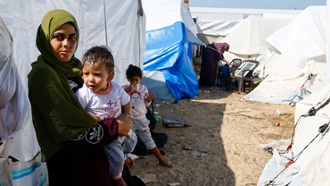 Người dân Palestine tại một trại tị nạn ở Dải Gaza. (Ảnh REUTERS)