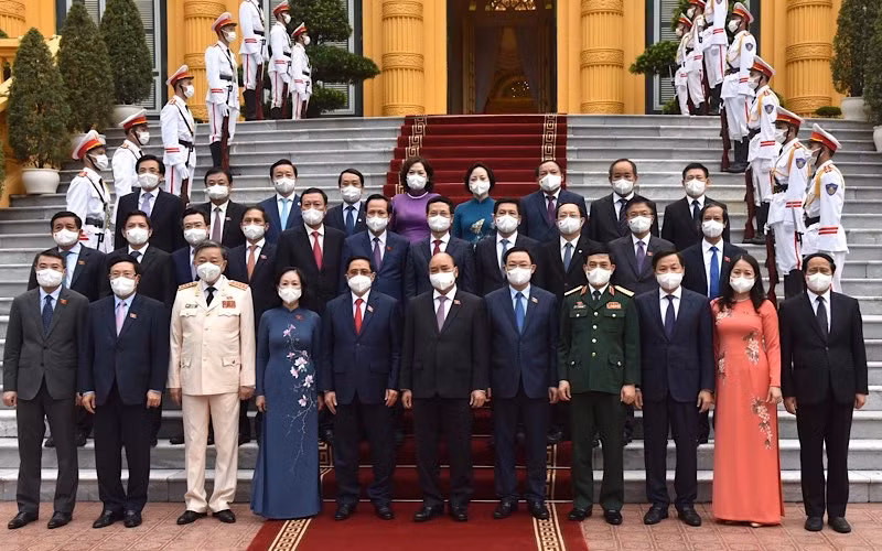 Chủ tịch nước Nguyễn Xuân Phúc, Thủ tướng Phạm Minh Chính, Chủ tịch Quốc hội Vương Đình Huệ và các thành viên Chính phủ, các đại biểu tại buổi lễ. (Ảnh: TRẦN HẢI)