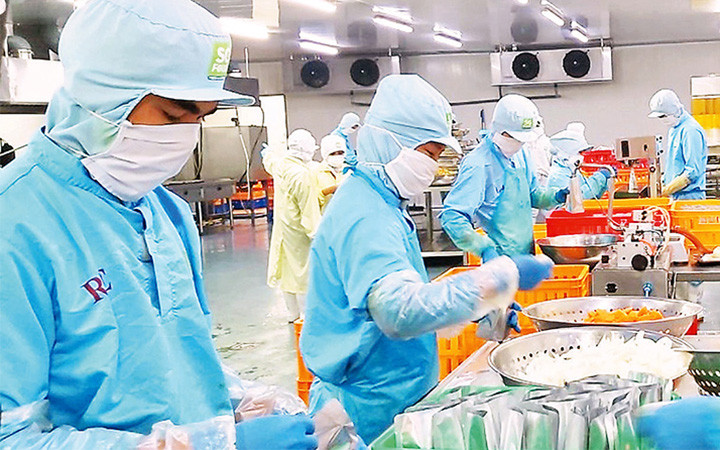 Lao động tại Công ty Sài Gòn Food. (Ảnh minh họa: Quang Quý)