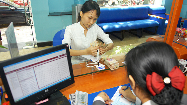 Tâm lý vững vàng của thị trường trong nước là bệ đỡ quan trọng cho sự ổn định của tỷ giá trong giai đoạn vừa qua. Ảnh: NAM ANH