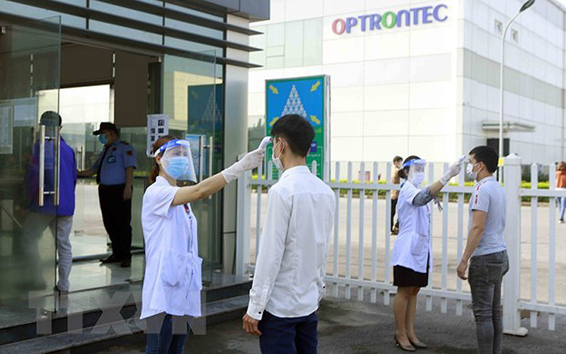 Phát huy hiệu quả Tổ An toàn Covid-19 tại các doanh nghiệp, đơn vị trên địa bàn thành phố Hà Nội. (Ảnh: TTXVN)