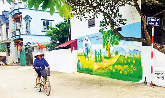 Đường giao thông nông thôn khang trang tại thôn Minh Kha, xã Bình Minh. Ảnh: HOÀNG LÂN