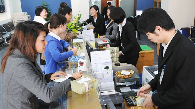 Từ đầu tháng 4 tới nay, tỷ giá đã dần ổn định, giá VND đã hồi phục dần. Ảnh: NAM ANH