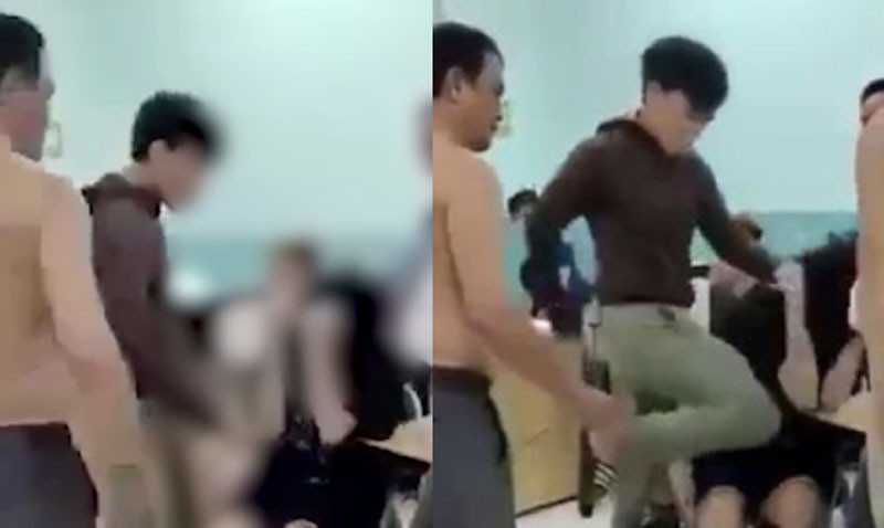 Hình ảnh bảo vệ dân phố đánh đập hai thiếu niên.