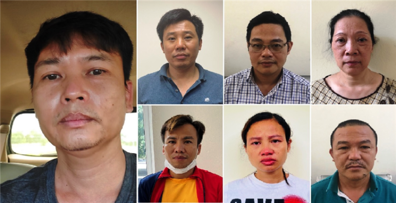 Các bị can (từ trái qua phải): Nguyễn Xuân Hanh; Đỗ Quang Tiến; Đỗ Khắc Tú Anh; Nguyễn Thị Ngọc Lâm; Nguyễn Tuấn Nghĩa; Kiều Thị Thúy; Hoàng Đình Văn.