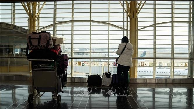 Hành khách tại sân bay quốc gia Ronald Reagan Washington ở Arlington, Virginia, Mỹ. (Ảnh minh họa: THX/TTXVN)