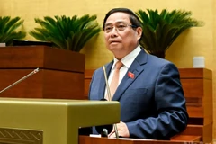 Thủ tướng Chính phủ Phạm Minh Chính trình bày Báo cáo tóm tắt kết quả thực hiện Kế hoạch phát triển kinh tế-xã hội năm 2025 và 5 năm 2021-2025; dự kiến kế hoạch phát triển kinh tế-xã hội năm 2026. (Ảnh: DUY LINH)