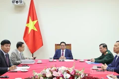 Thủ tướng Chính phủ Phạm Minh Chính điện đàm với Thủ tướng Malaysia Anwar Ibrahim. (Ảnh: TRẦN HẢI)