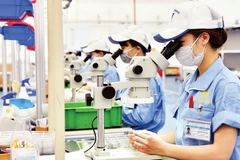 Công nhân sản xuất linh kiện cơ khí tại Công ty TNHH Fujikin Bắc Ninh (Khu công nghiệp VSIP, tỉnh Bắc Ninh). (Ảnh: NGUYỄN ĐĂNG)