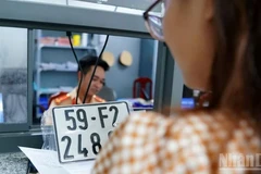 Thủ tướng Chính phủ phê duyệt giảm phí, lệ phí đăng ký xe 30%. (Ảnh minh họa: BÁO NHÂN DÂN)