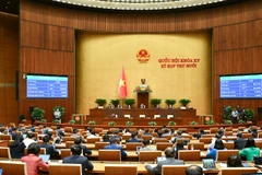 Với đa số đại biểu Quốc hội biểu quyết tán thành, Quốc hội thông qua Luật Quản lý thuế (sửa đổi). (Ảnh: DUY LINH)