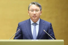 Bộ trưởng Tư pháp Nguyễn Hải Ninh trình bày Báo cáo về công tác thi hành án năm 2025. (Ảnh: DUY LINH)