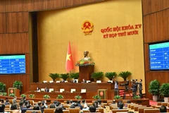 Với 429 đại biểu Quốc hội tham gia biểu quyết tán thành, đạt 90,51% tổng số đại biểu Quốc hội, Quốc hội thông qua Luật Tương trợ tư pháp về dân sự. (Ảnh: DUY LINH)