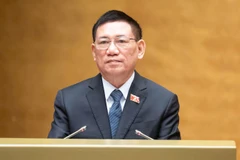 Phó Thủ tướng Chính phủ Hồ Đức Phớc trình bày Tờ trình. (Ảnh: DUY LINH)