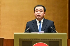 Bộ trưởng Nông nghiệp và Môi trường Trần Đức Thắng trình bày Tờ trình dự thảo Nghị quyết. (Ảnh: DUY LINH)