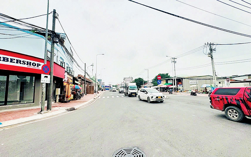 Đường Hưng Nhơn, xã Tân Kiên, huyện Bình Chánh sau khi được nâng cấp, mở rộng, không còn tình trạng ngập nước.