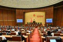 Quang cảnh phiên họp của Quốc hội sáng 10/12. (Ảnh: DUY LINH)