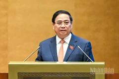 Thủ tướng Chính phủ Phạm Minh Chính trình bày Báo cáo kết quả thực hiện kế hoạch phát triển kinh tế-xã hội năm 2025 và 5 năm 2021-2025; dự kiến kế hoạch phát triển kinh tế-xã hội năm 2026. (Ảnh: DUY LINH)