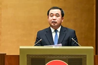 Bộ trưởng Nông nghiệp và Môi trường Trần Đức Thắng trình bày Tờ trình dự thảo Nghị quyết. (Ảnh: DUY LINH)