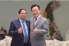 Thủ tướng Phạm Minh Chính và Tổng thống Hàn Quốc Lee Jae Myung. (Ảnh: VGP/Nhật Bắc)