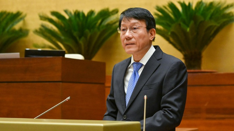 Bộ trưởng Công an Lương Tam Quang trình bày Tờ trình của Chính phủ về dự án Luật Bảo vệ bí mật nhà nước (sửa đổi). (Ảnh: THỦY NGUYÊN) chi-8937-8593.jpg