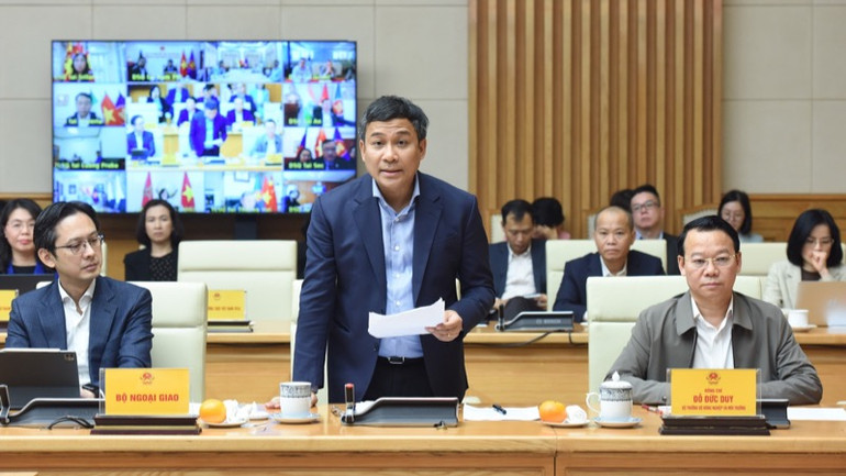 Thứ trưởng Thường trực Ngoại giao Nguyễn Minh Vũ phát biểu ý kiến (Ảnh: TRẦN HẢI).